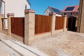 Beautiful Feather Edge Panel with Brick Posts installed by ALTI Expert for a  new build residential property in the UK.
